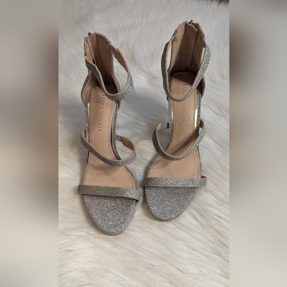 Beautiful silver glittered open toe heels. Size 8 True to size. Kelly & Katie.